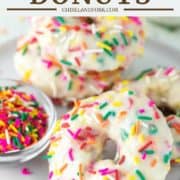 baked vanilla donuts with sprinkles on white plate