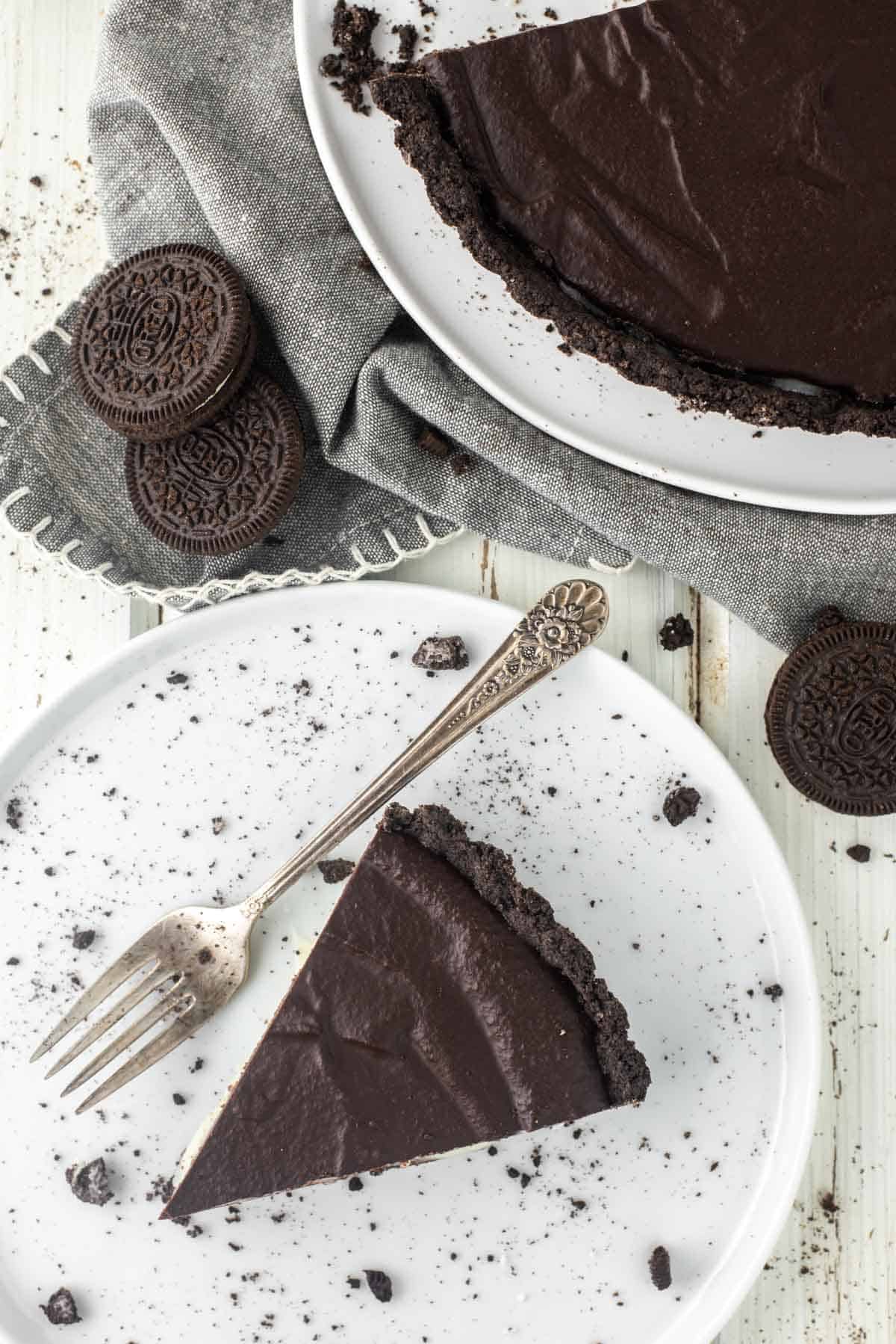 overhead shot of a slice of Oreo tart on plate with fork