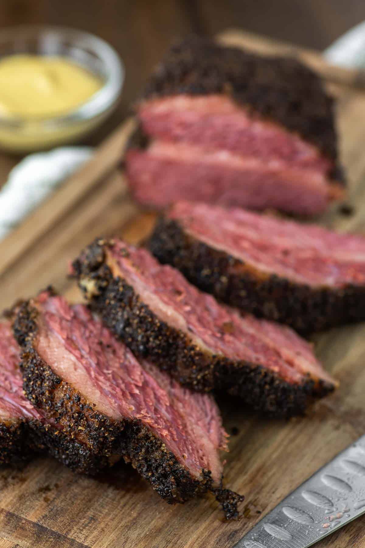 slices of smoked corned beef on cutting board