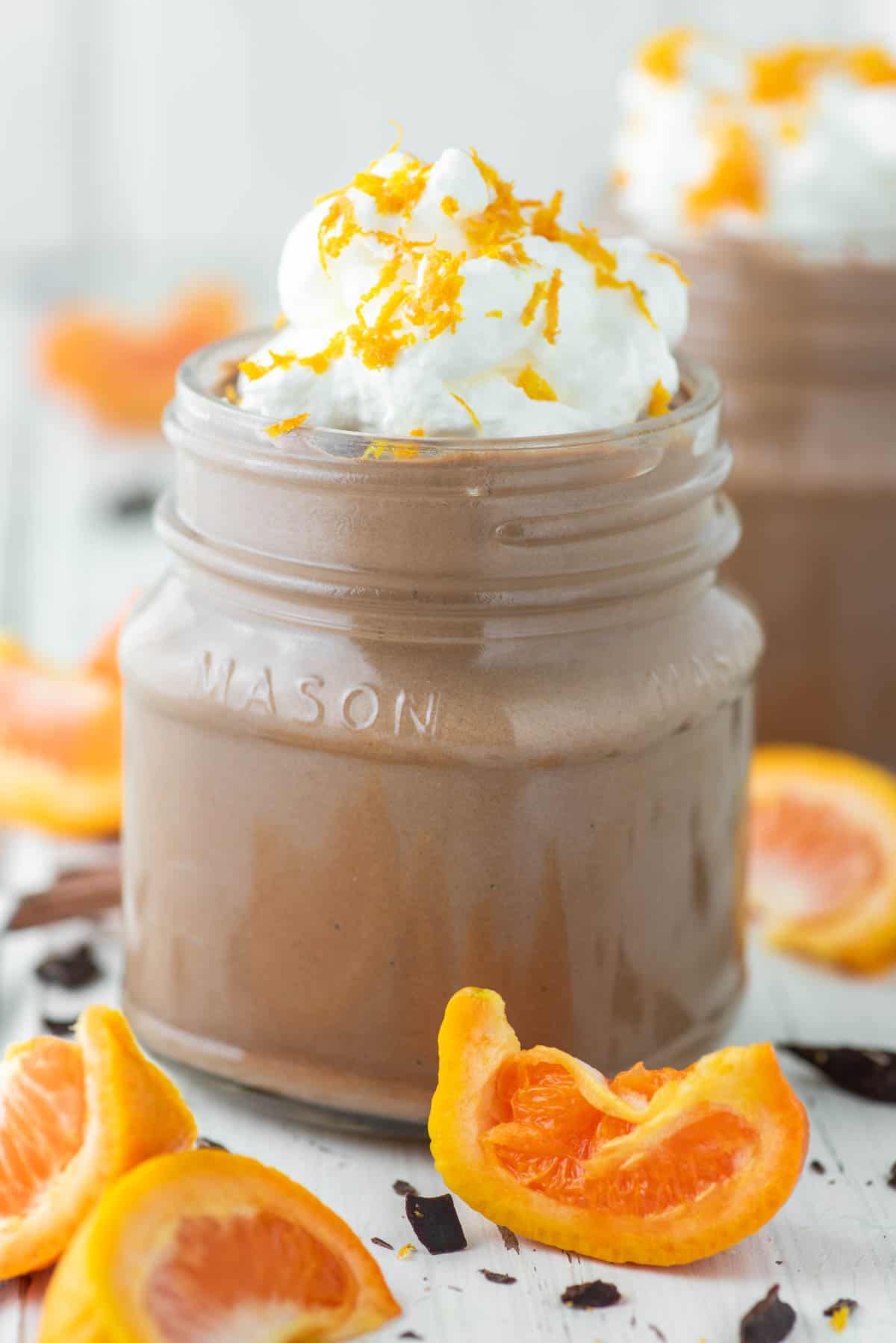 two glass jars of chocolate orange mousse