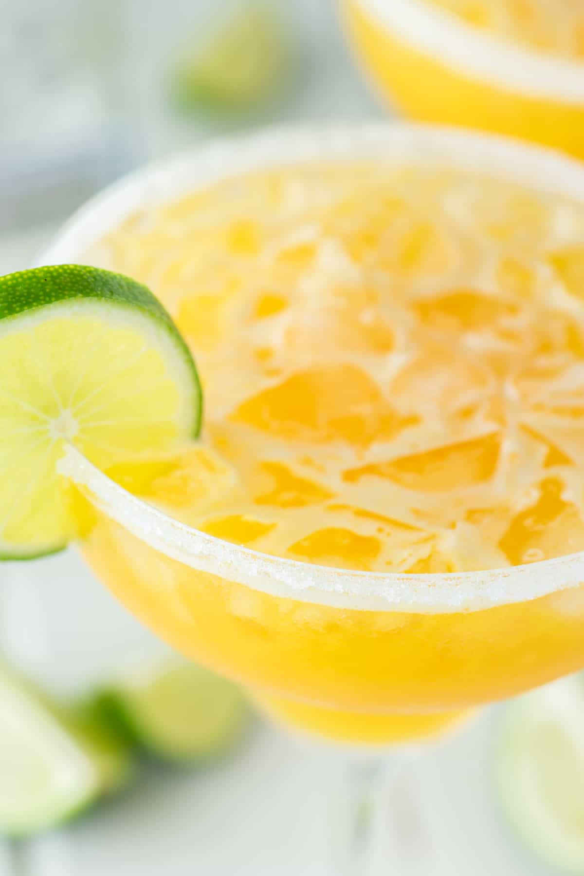 close-up of passion fruit margarita in glass