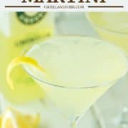 limoncello martini with lemon peel and lemons in background