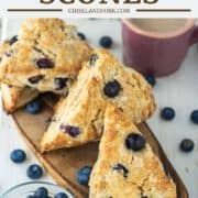 blueberry scones stacked on wood board