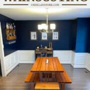 white wainscoting in dining room with blue walls