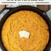 overhead shot of sweet potato cornbread in cast iron skillet with butter