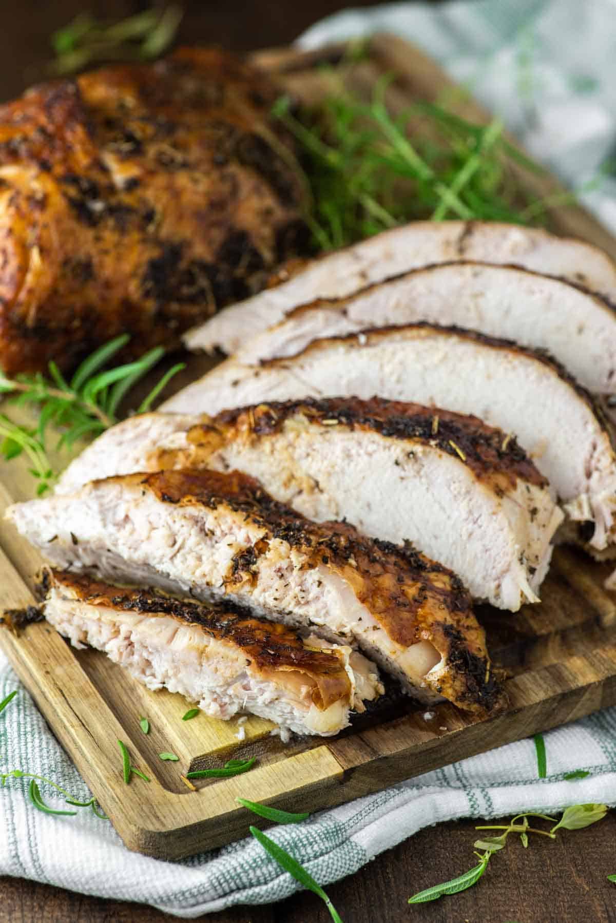 slices of smoked turkey breast on wood board