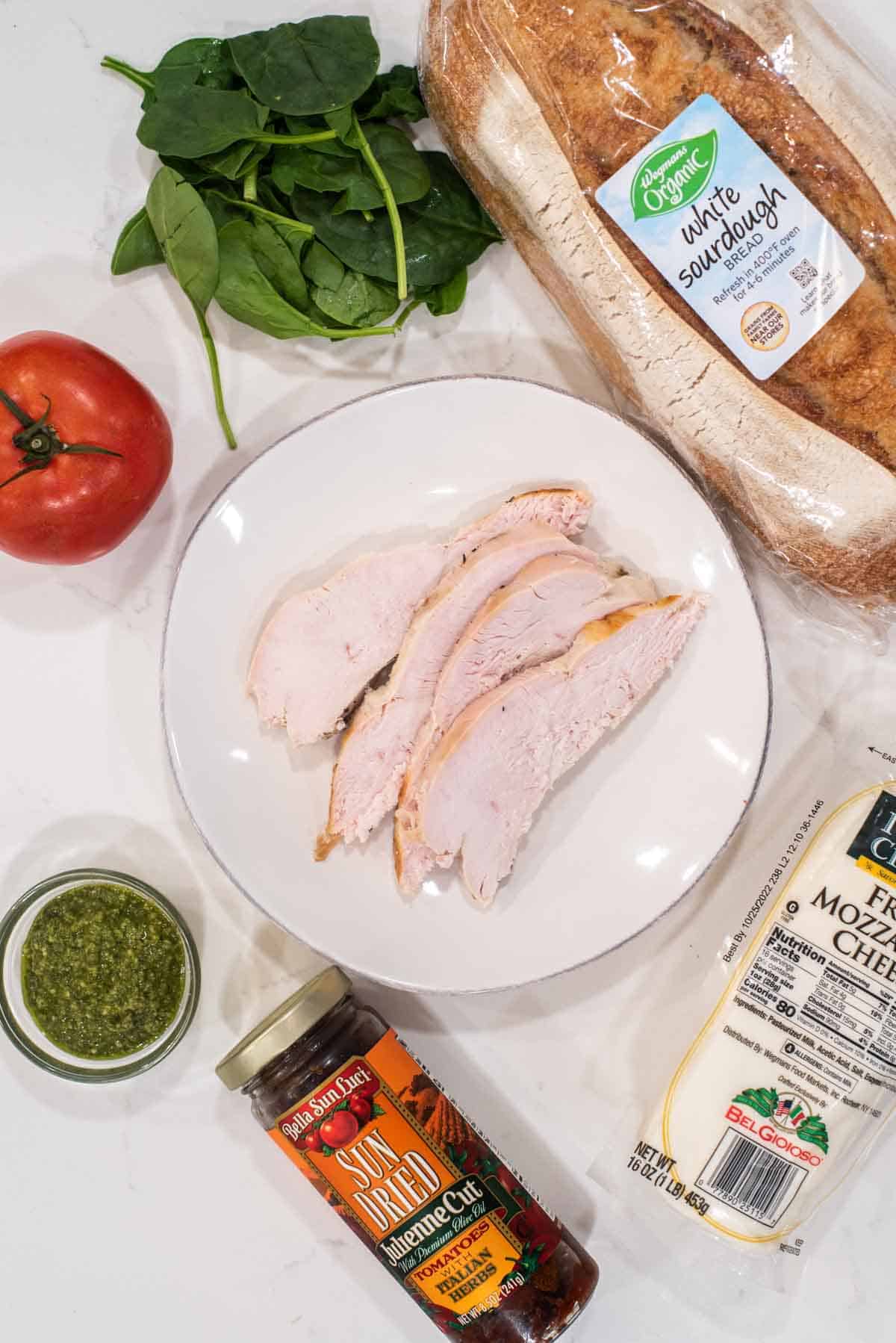 overhead shot of ingredients for turkey pesto sandwich