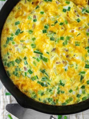 overhead shot of ham and cheese frittata in skillet