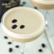 close-up of Baileys espresso martini in coupe glass with another in the background