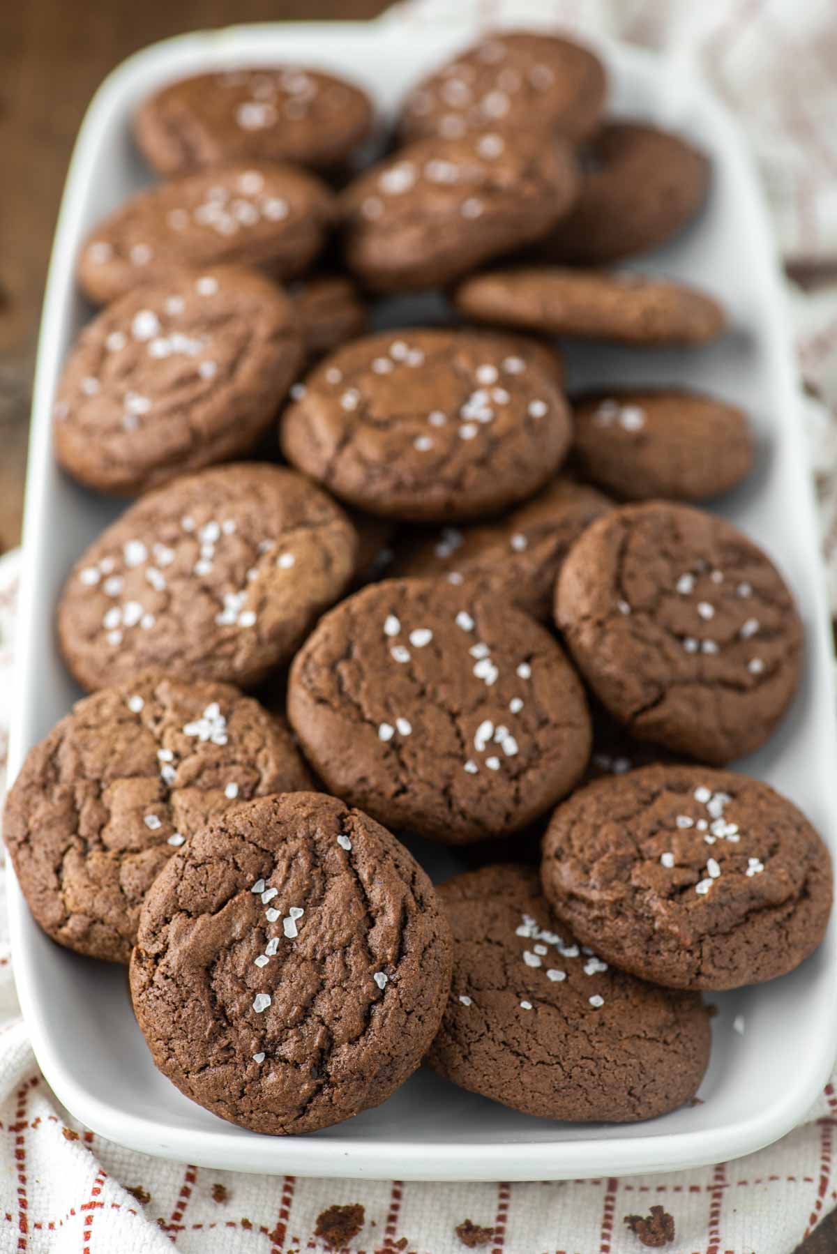 close-up of brownie crinkle cookies on white plate
