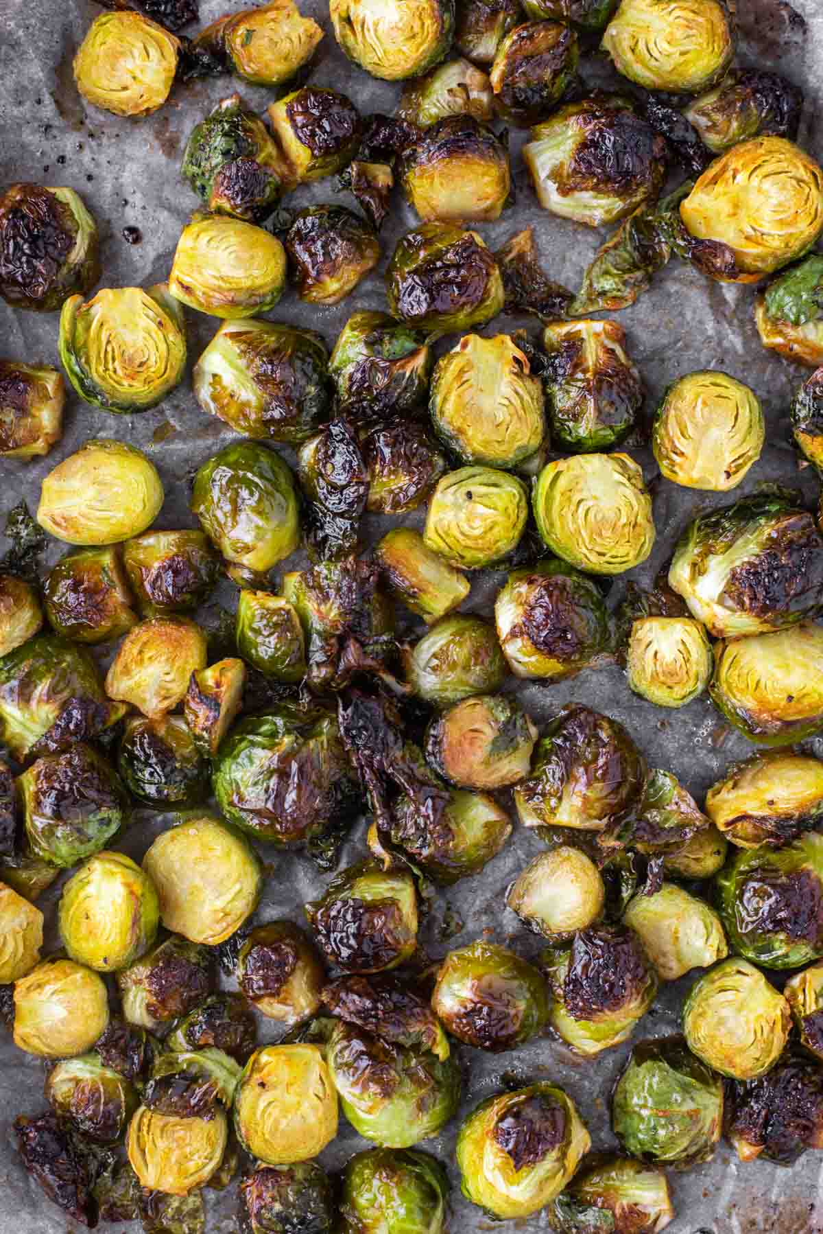 overhead shot of honey sriracha Brussels sprouts on baking sheet