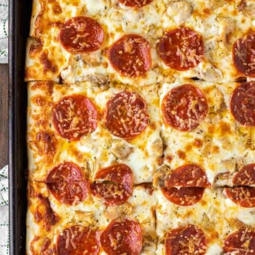 overhead shot of chicken pepperoni pizza on sheet pan