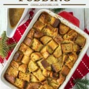 ot of eggnog bread pudding in baking pan with bowl of rum sauce