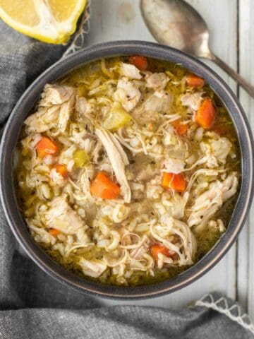 overhead shot of Instant Pot chicken and rice soup in grey bowl