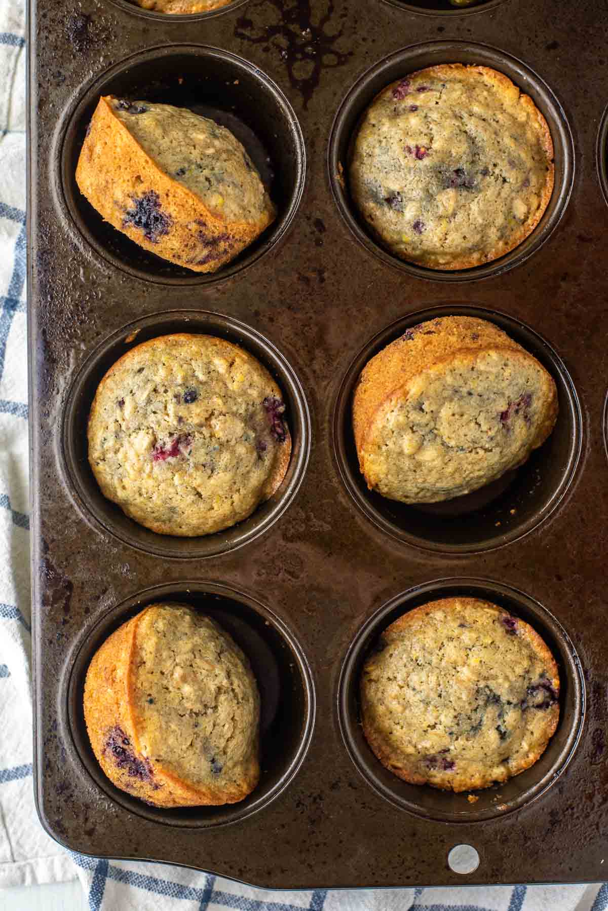 overhead shot of blackberry oatmeal muffins in muffin tin