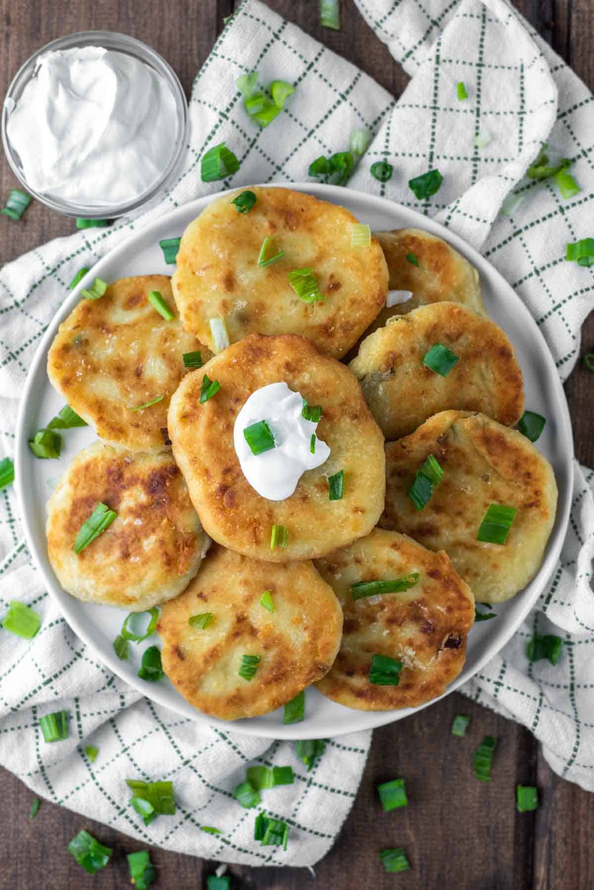overhead shot of mashed potato fritters stacked on plate