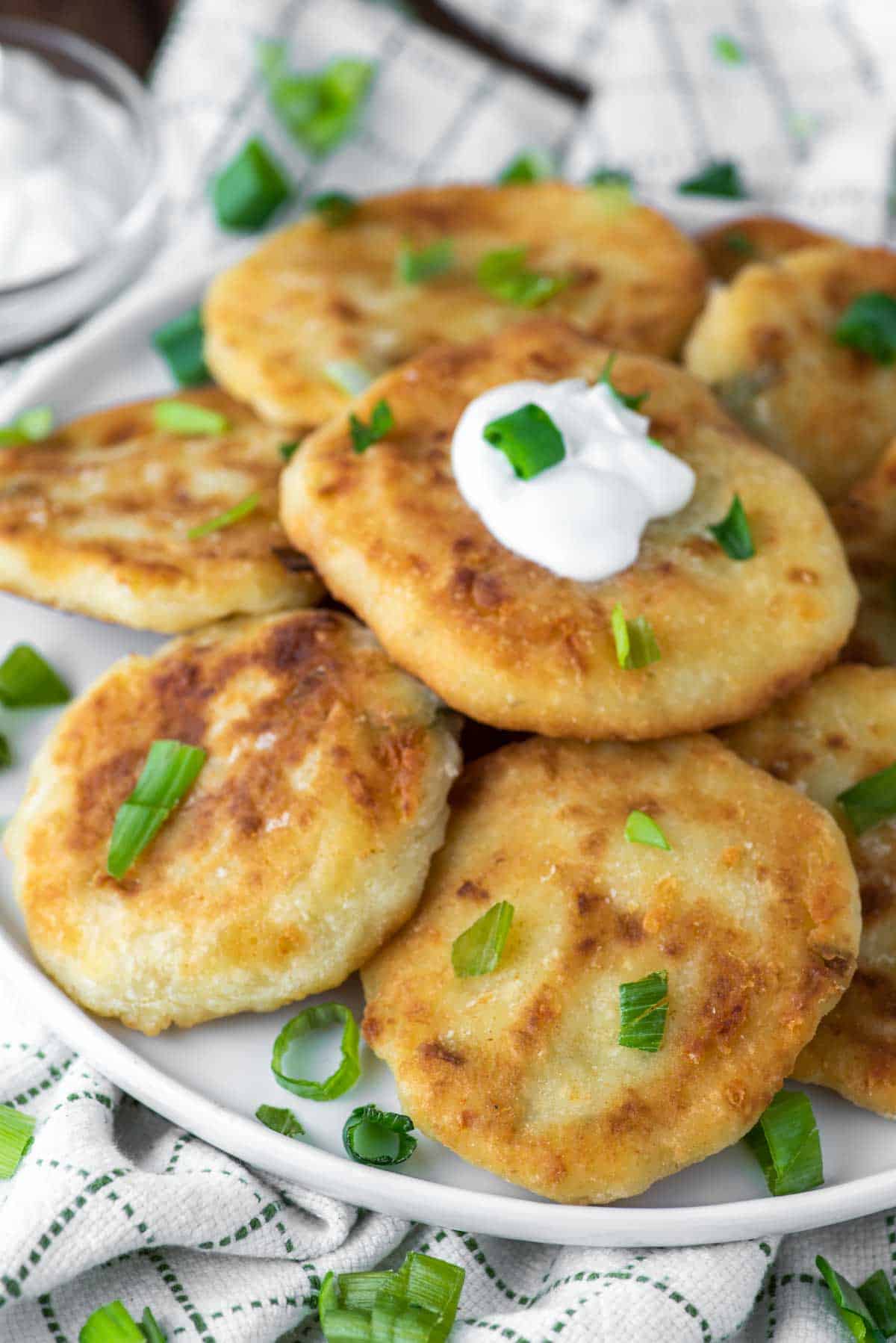 close-up of stacked mashed potato fritters on plate