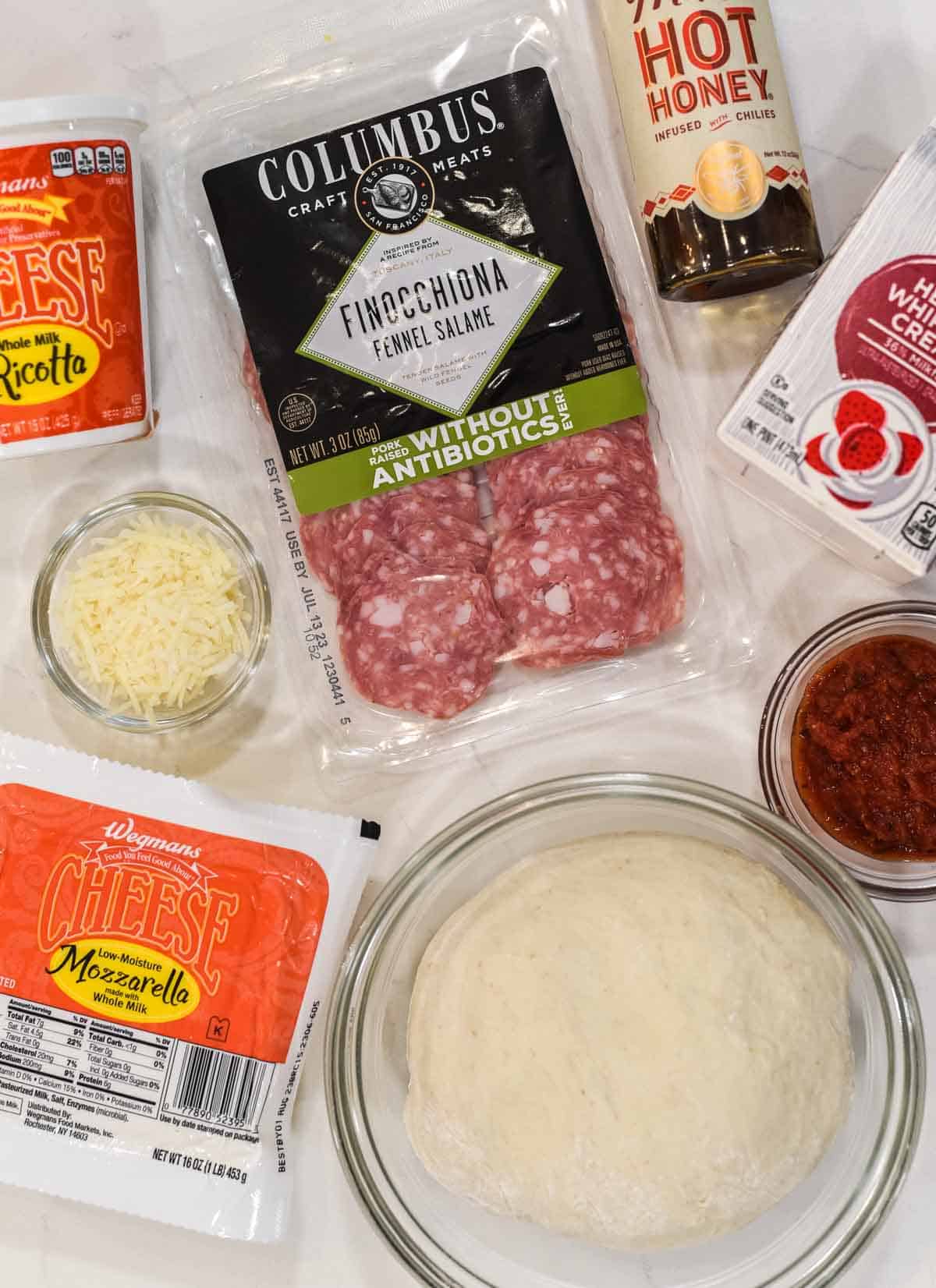 overhead shot of ingredient for salami pizza