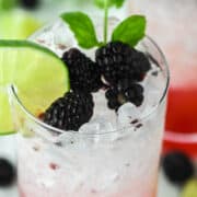 close-up of blackberry mojito in tall glass