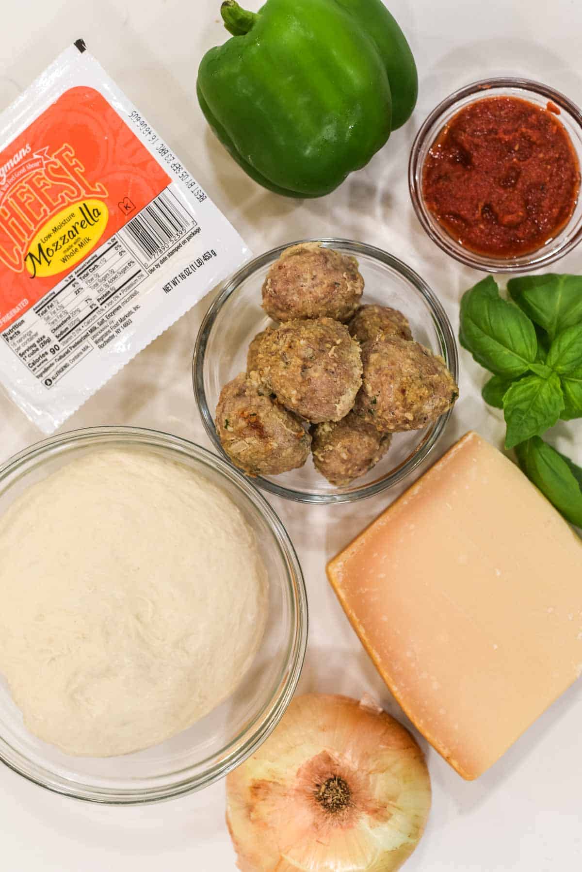 overhead shot of ingredients for meatball pizza