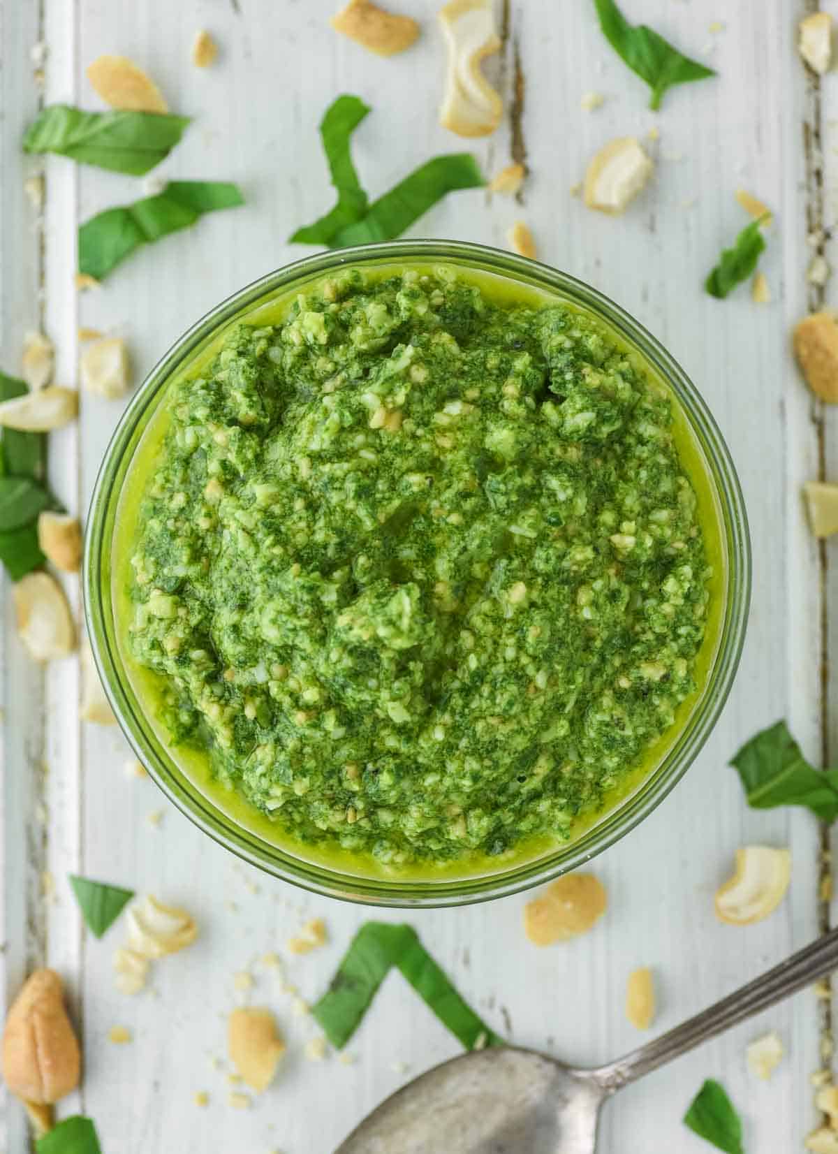 overhead shot of glass bowl filled with cashew pesto