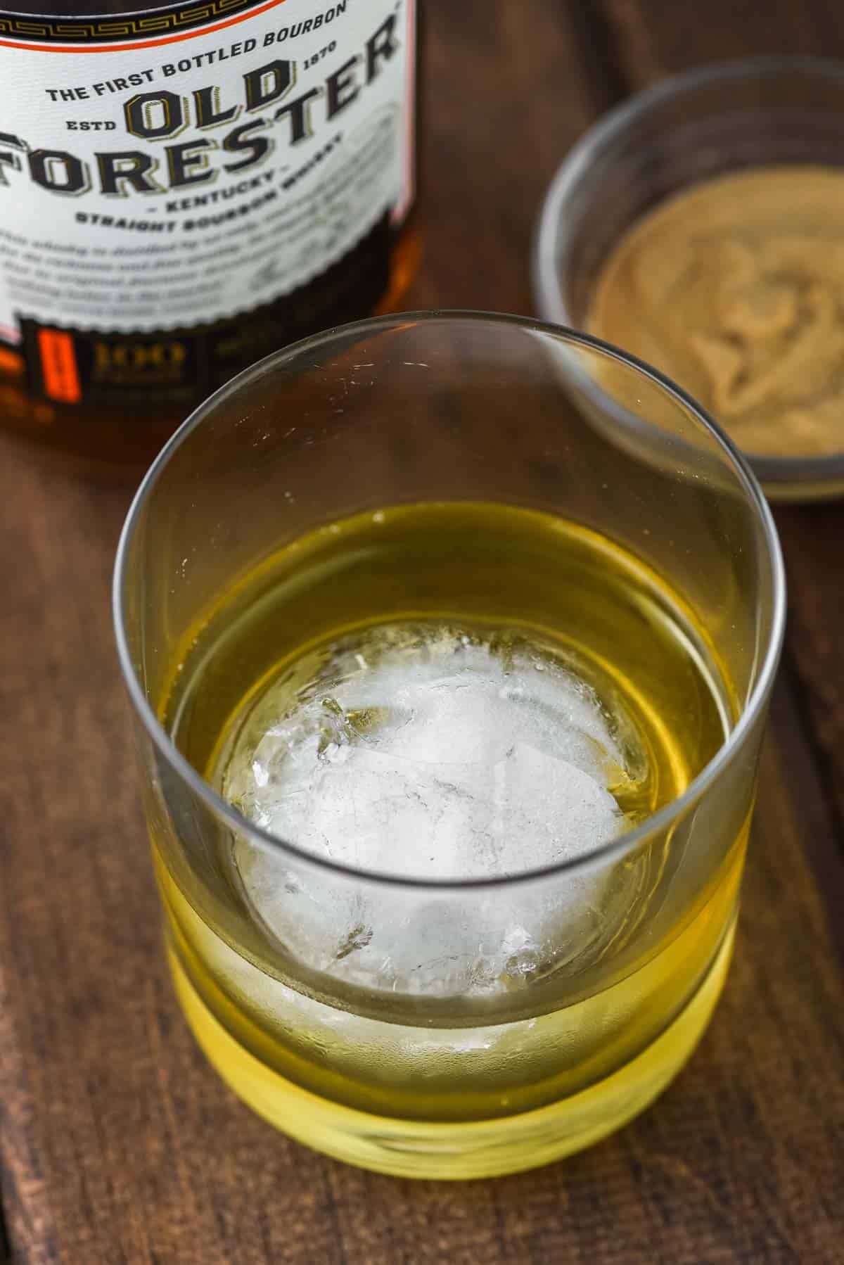 close-up of peanut butter whiskey in old fashioned glass with ice