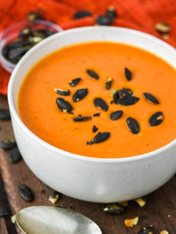 butternut squash and roasted red pepper soup on bowl