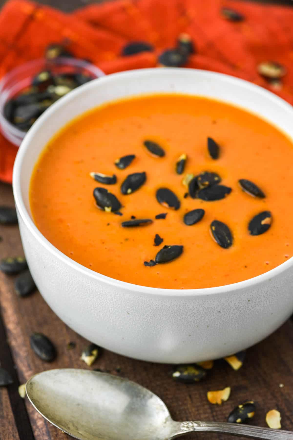 butternut squash and roasted red pepper soup on bowl