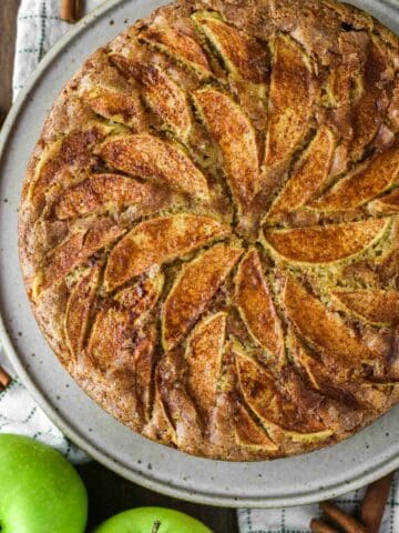 overhead shot of Dutch apple cake on speckled plate