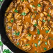 overhead shot of chicken satay curry in skillet