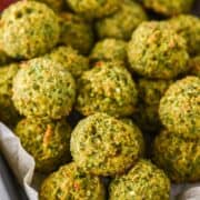 close-up of broccoli bites in parchment-lined tin