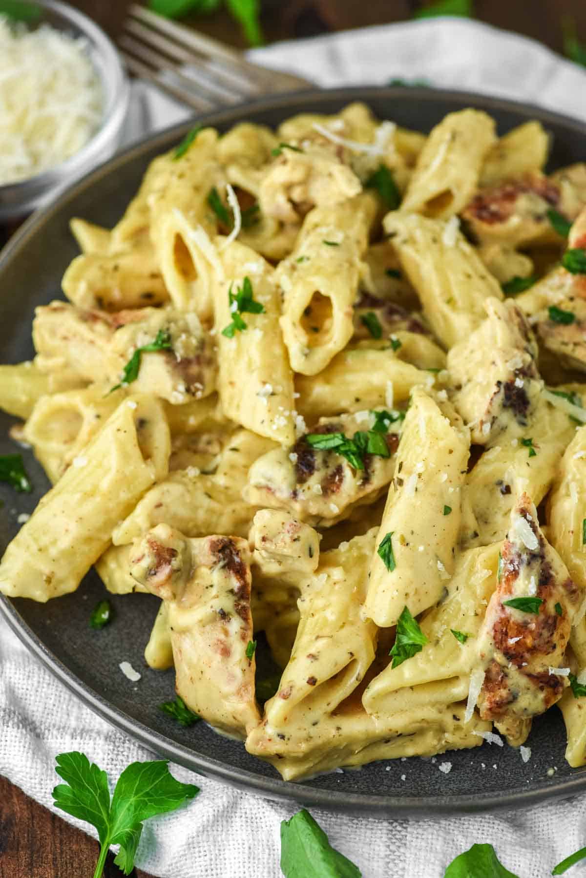 close-up of plate of garlic chicken parmesan pasta