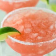 close-up of guava margarita in margarita glass with another in a background