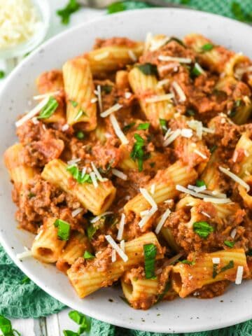 close-up of rigatoni bolognese in pasta bowl