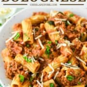 close-up of rigatoni bolognese in pasta bowl